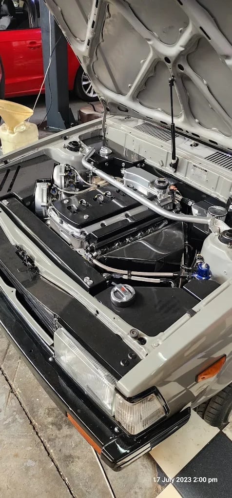 Engine bay work at Joburg Auto Tech showing professional mechanics